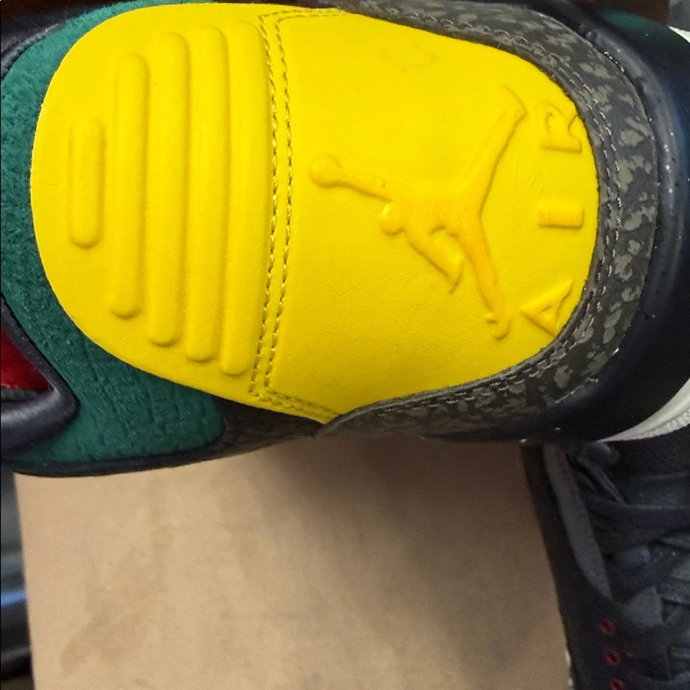 Jordan Low-Top Sneakers in Black with Red, Yellow, and Green Accents